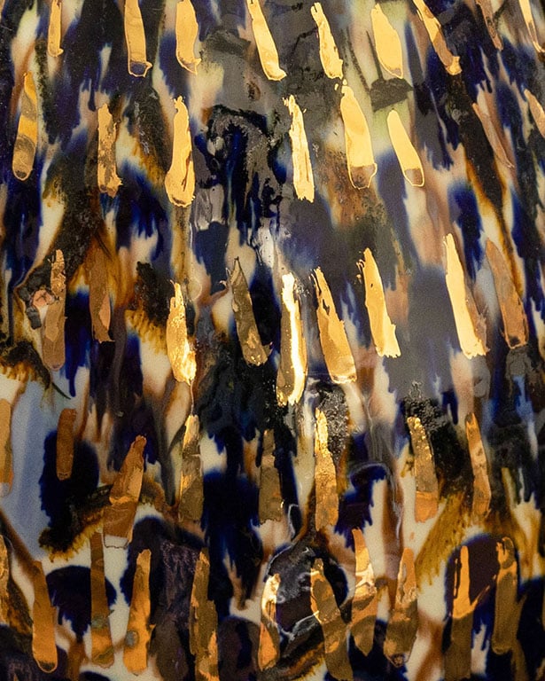 close up of - Unique porcelain object by artist Pia Andersen, combining tactile underglazes, expressive oxides and luminous 14-carat gold in a one-of-a-kind sculptural piece.